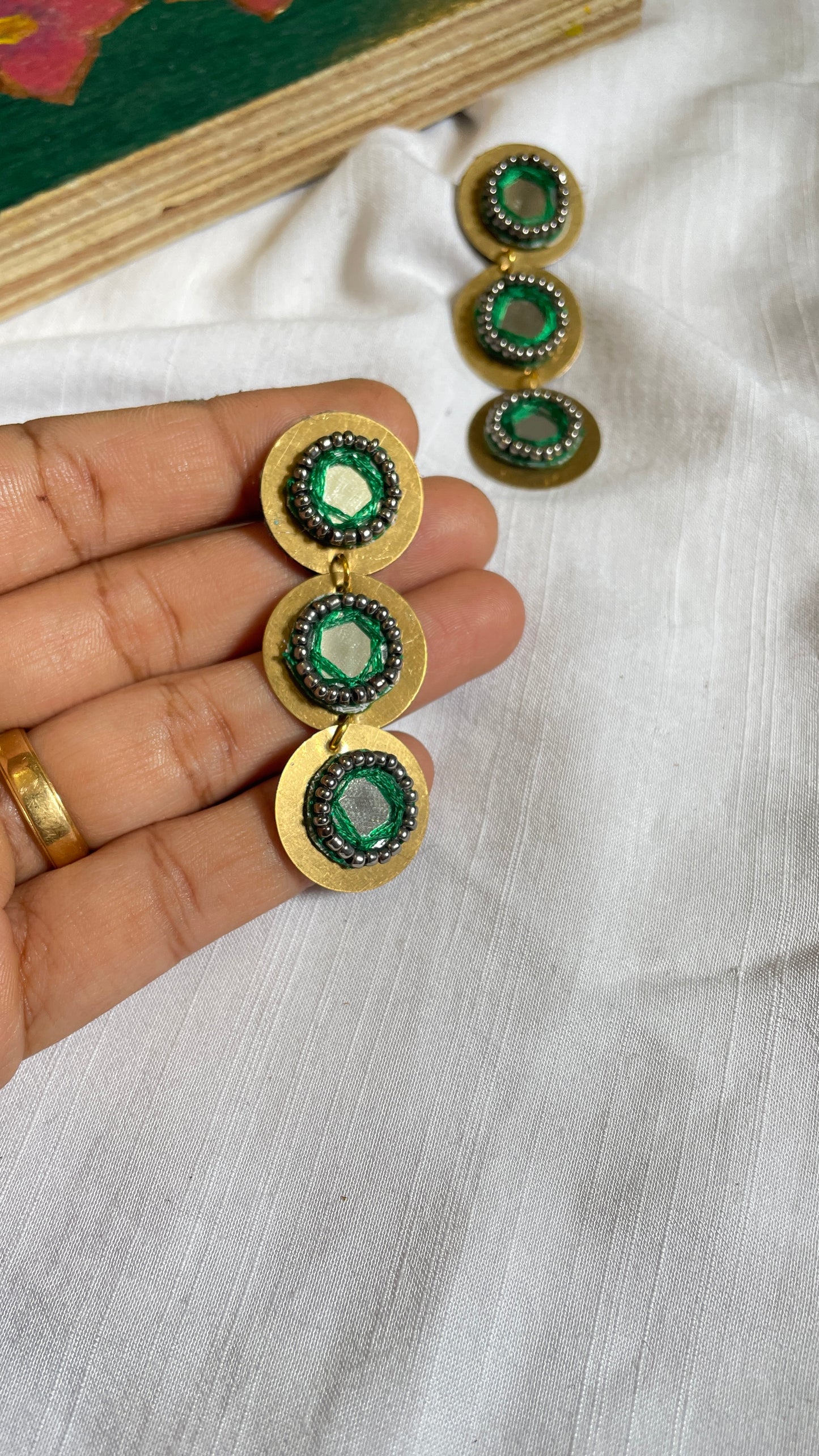Green layered brass earrings